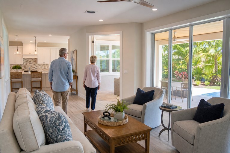 Older couple touring a bright single-story Florida home