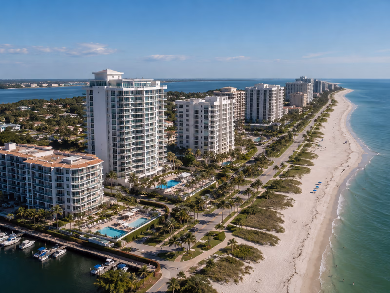 Waterfront condominium towers across blue Gulf Coast water in Clearwater, Florida