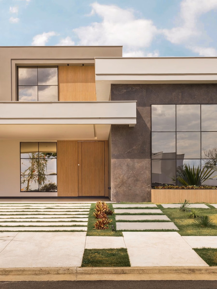 Completed contemporary new-construction home with a landscaped front entry