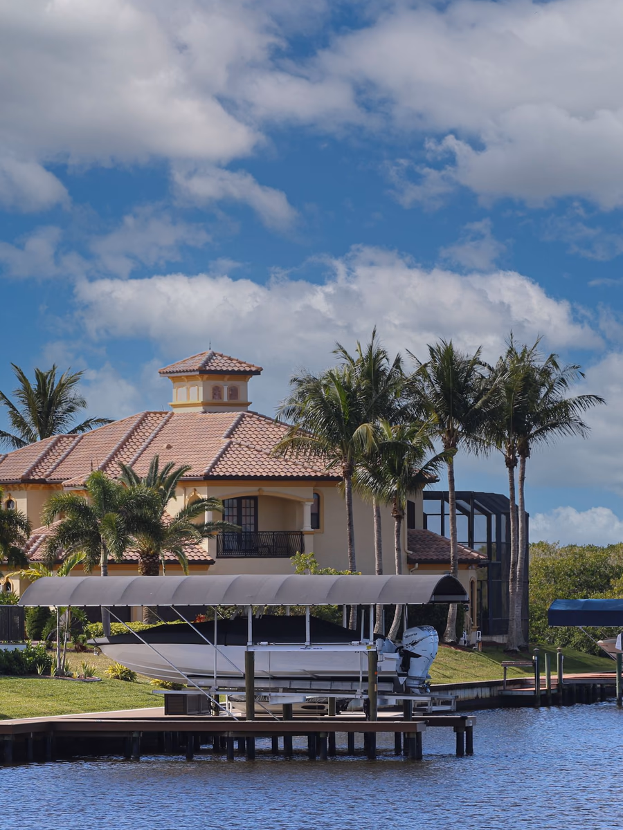 Florida waterfront home with a private dock, boat lift, and canal access in Cape Coral